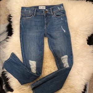 DL1961 dark wash ripped jeans .